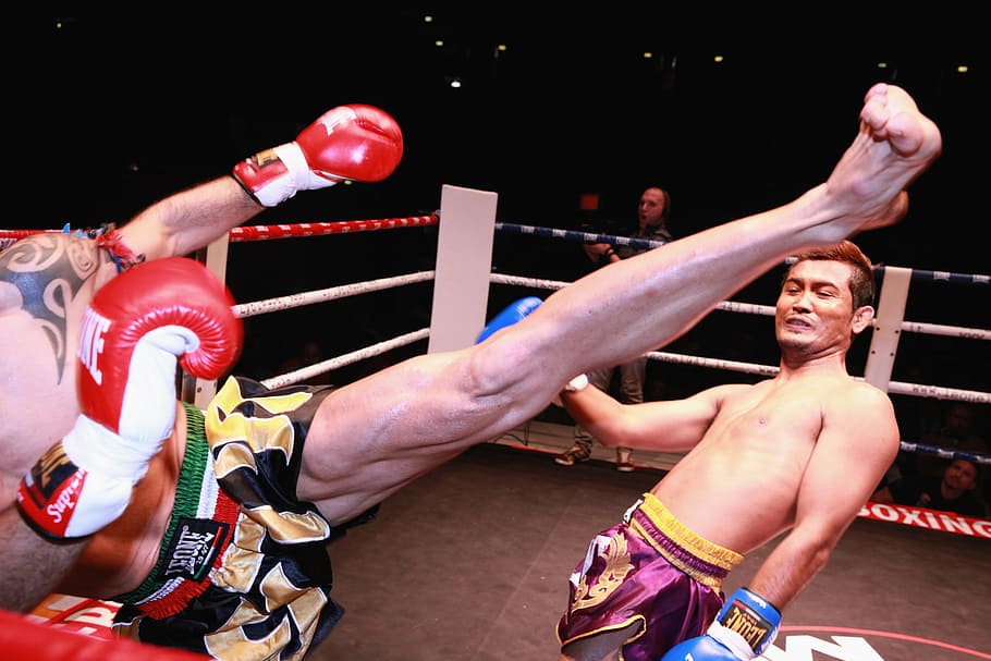 person kicking man on ring, football, boxing, combat, gloves