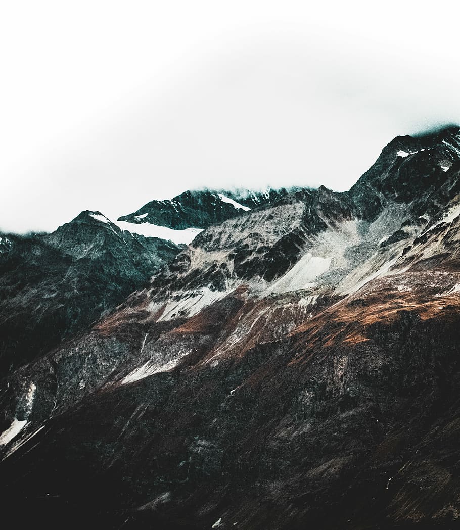 landscape photography of snowy mountain, black and white mountains under clear sky HD wallpaper