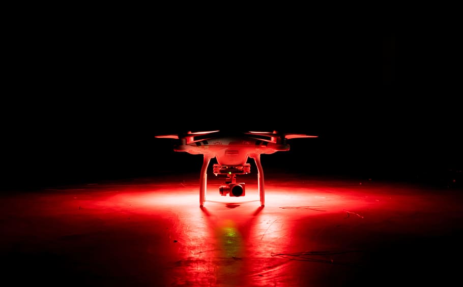 white quadcopter drone on surface, dark, night, red, light HD wallpaper