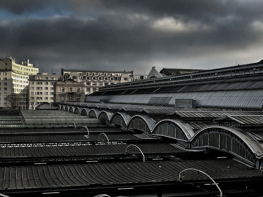 view of concrete building roof, portrait photography of structure roof under dark clouds during daytime HD wallpaper