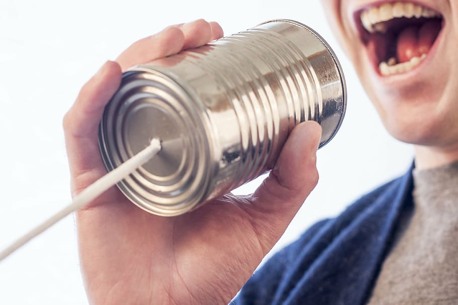 person holding grey can with string, speak, talk, microphone HD wallpaper