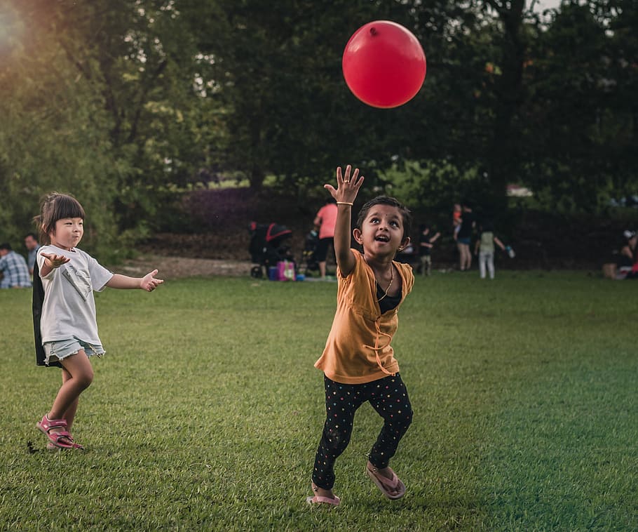 Happy Kids, two boy and girl playing with red balloon, park, grass HD wallpaper