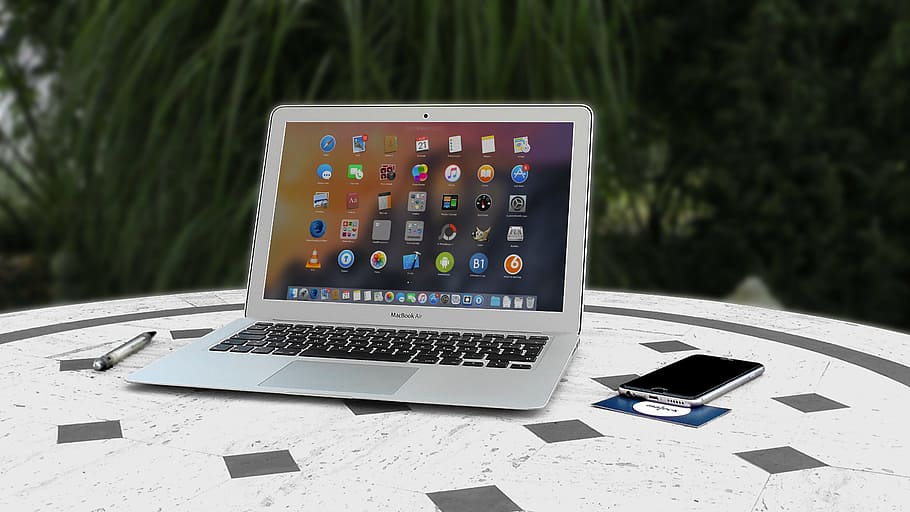 MacBook Air beside space gray iPhone 6 on top of table, office HD wallpaper