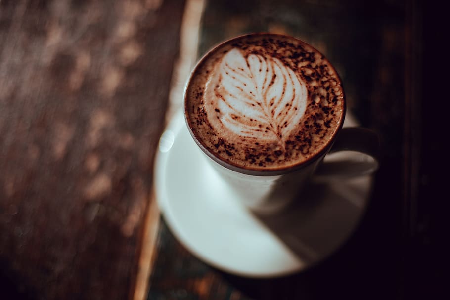 photo of coffee with saucer, shallow focus photo of brown and white liquid-filled ceramic mug on saucer HD wallpaper