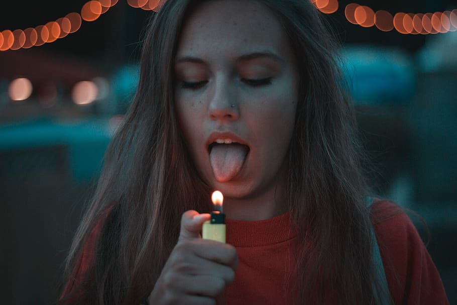 woman lighting up her tongue, woman lighting yellow disposable lighter, HD wallpaper