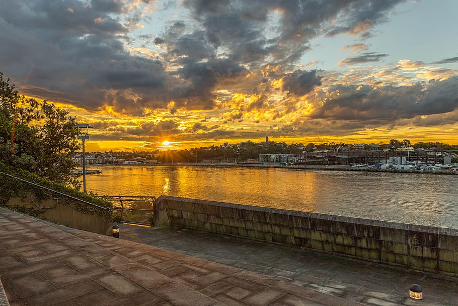 body of water near buildings during golden hour, sunset, landscape HD wallpaper