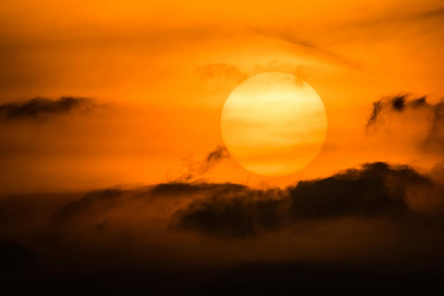 golden sun, clouds, sunset, setting sun, dark clouds, passing clouds HD wallpaper
