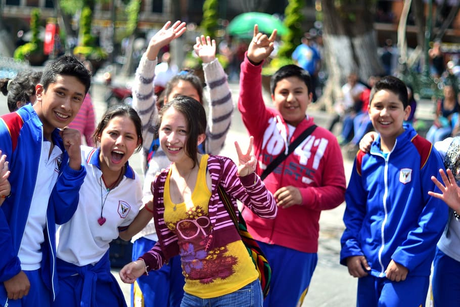 group of people standing on street, fellow, students, young HD wallpaper