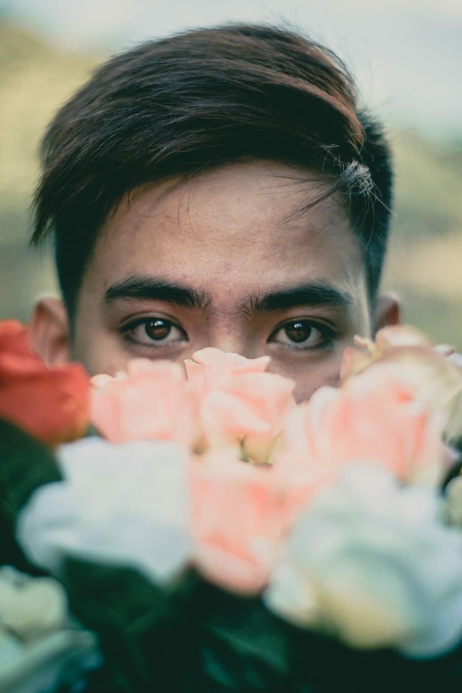 man hiding behind pink and white flowers, focus photo of man with flowers, HD wallpaper