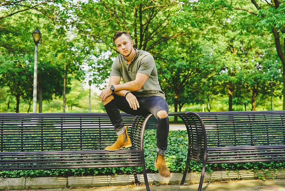 man seating on bench, man sitting on black steel bench, full length HD wallpaper