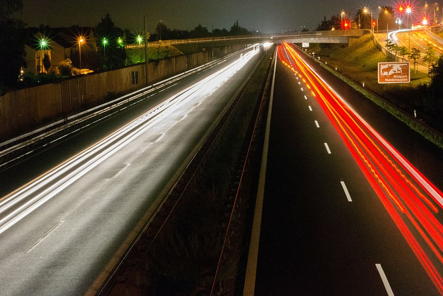 highway, night, traffic, spotlight, lights, movement, taillights HD wallpaper