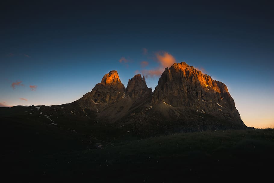 mountain during sunset, brown mountain under golden hour, low angle