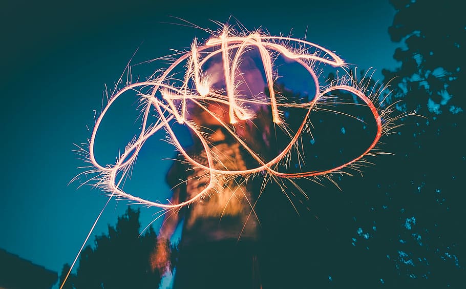 person using light drawing, time lapse photo of red fire, firework HD wallpaper