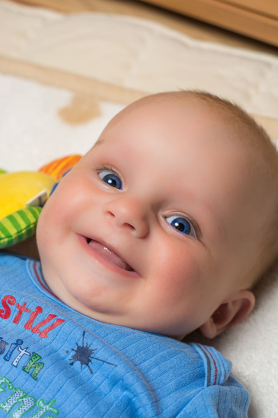smiling baby lying on bed, child, small child, face, cute, boy
