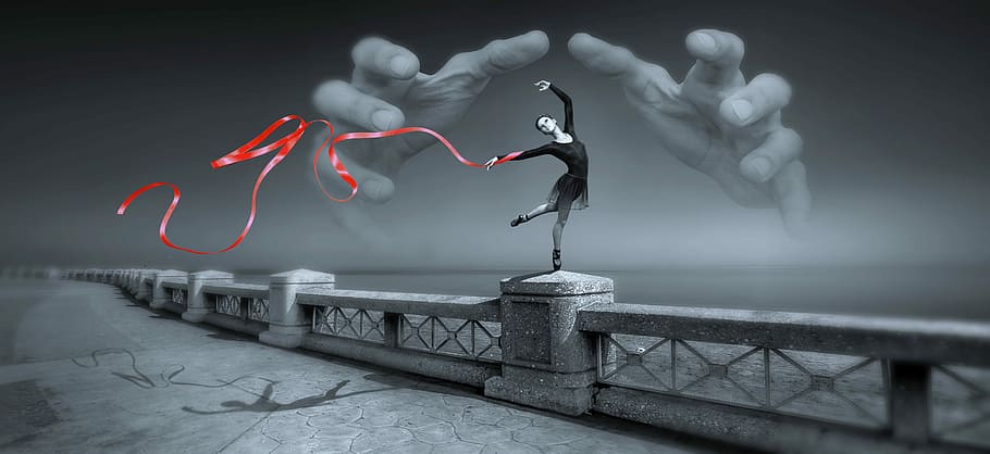woman performing gymnastic routine on top of grey concrete railings with both of hands image behind wallpaper