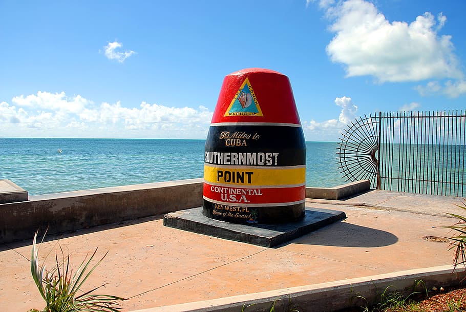 round red and black Southernmost point statue, southern most point