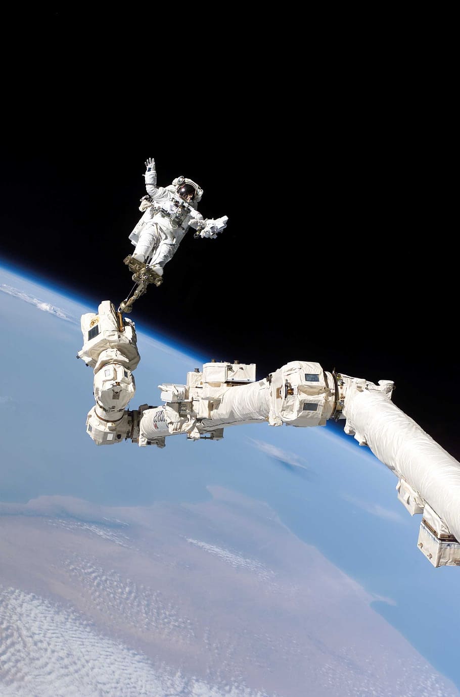 Astronaut taking selfie outside of the earth, space walk, international space station