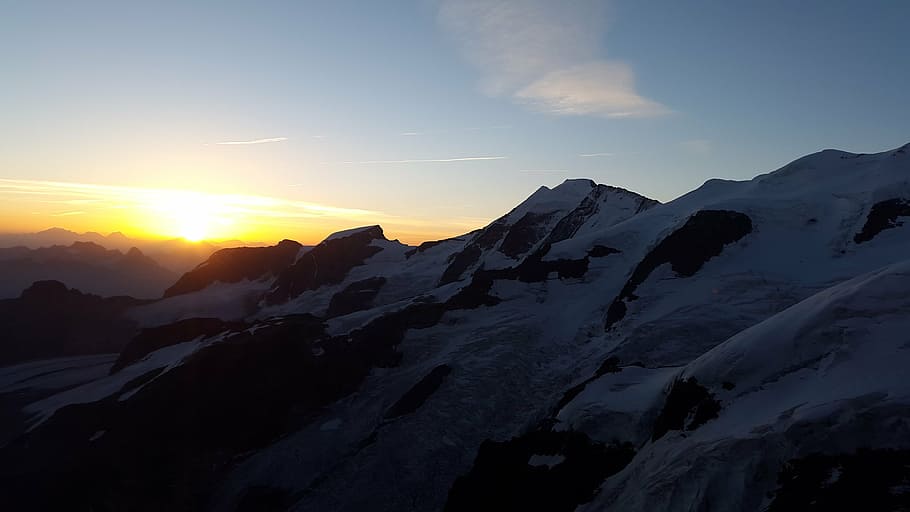 glacier mountain range during golden hour, sunrise, alpine, summit