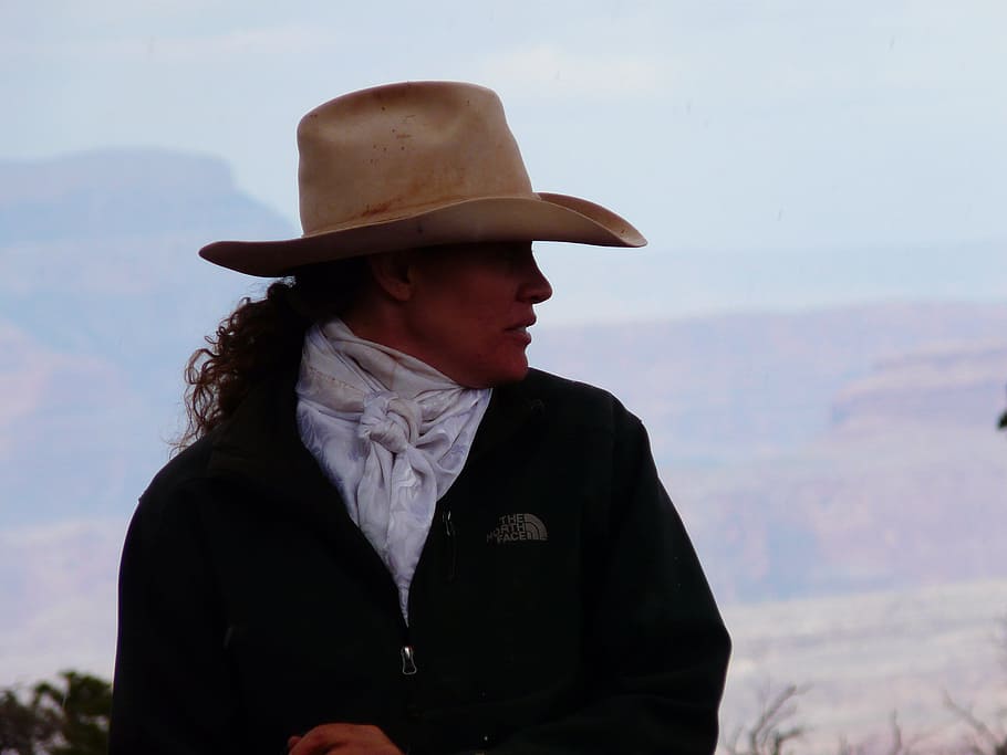 woman in black The North Face jacket wearing brown cowboy hat during daytime, HD wallpaper