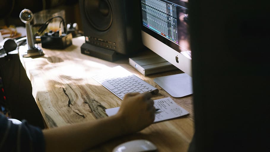 man using silver iMac during daytime, computer, keyboard, apple HD wallpaper