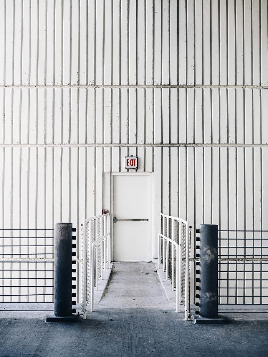 architectural photography of exit door with bridge, gray concrete foot bridge leading to exit inside the building, HD wallpaper