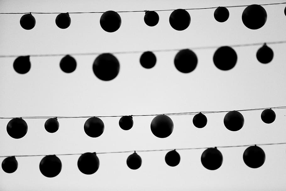 low angle photo of silhouette of round hanging decors, black HD wallpaper