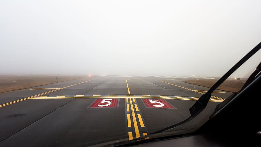 person in aircaft on gray runway, Airport, Fog, Airplane, Aircraft