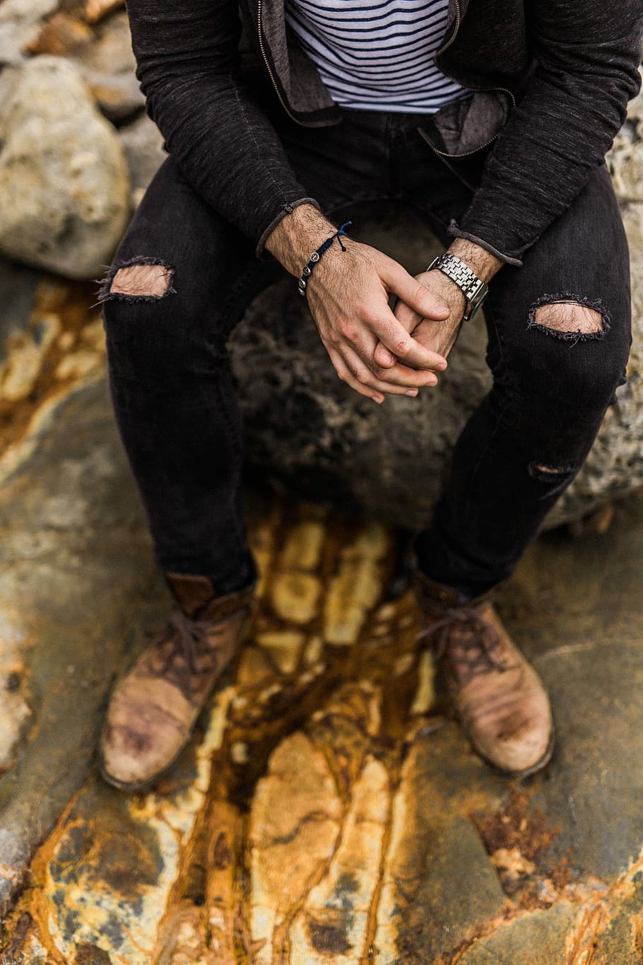 man sitting on rock, model, male, guy, denim jeans, one person HD wallpaper