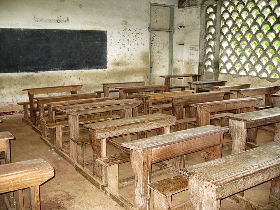 brown and white classroom interior, cameroon, school, desks, benches