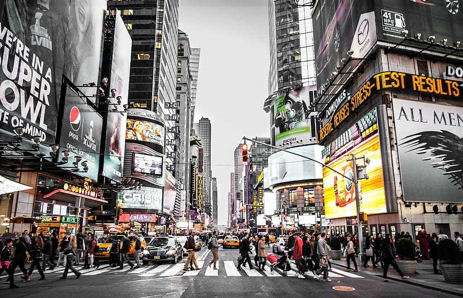 New York street during daytime, time lapse photography of people walking across Time Square, New York road