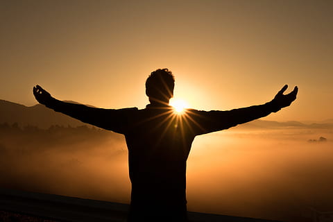 silhouette photo of man on cliff during sunset, silhouette of man during sunrise HD wallpaper