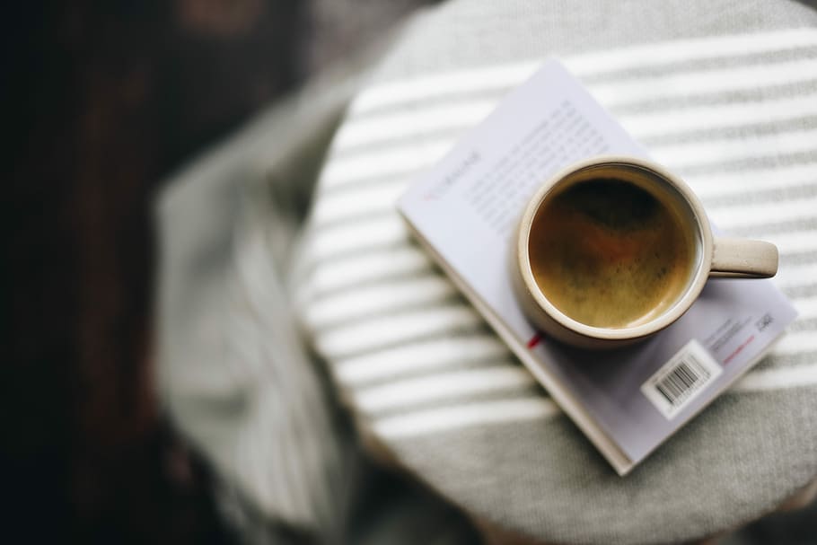 white ceramic mug with coffee on book, white ceramic mug on book HD wallpaper