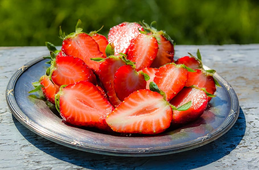 sliced strawberries on round gray plate, strawberry, fruit, plated