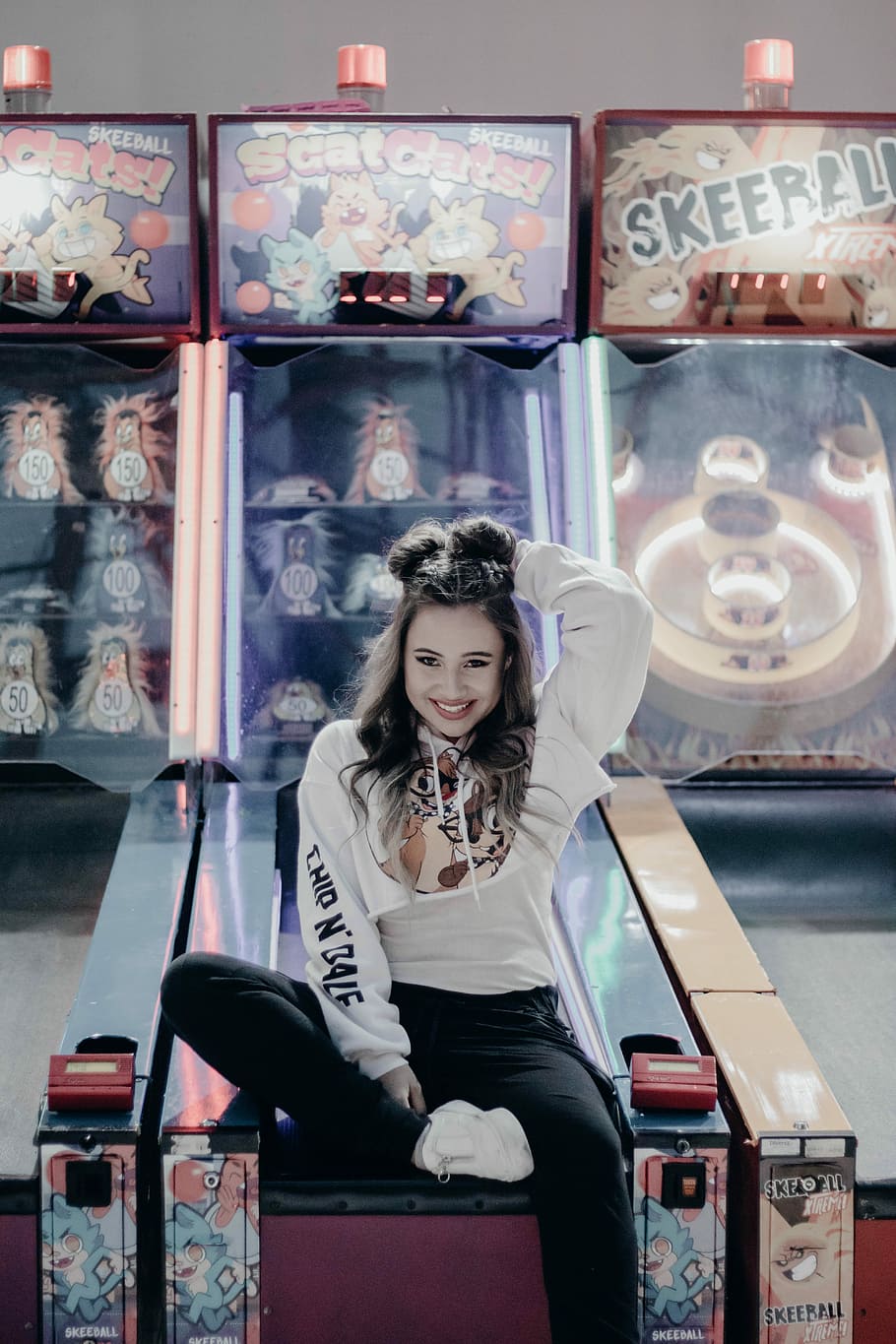 HD wallpaper: woman sitting in pinball, photo of girl in white sweatshirt  sitting on arcade game | Wallpaper Flare