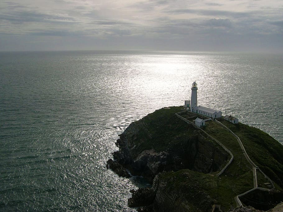 aerial photography of lighthouse during daytime, cliffs, ocean HD wallpaper