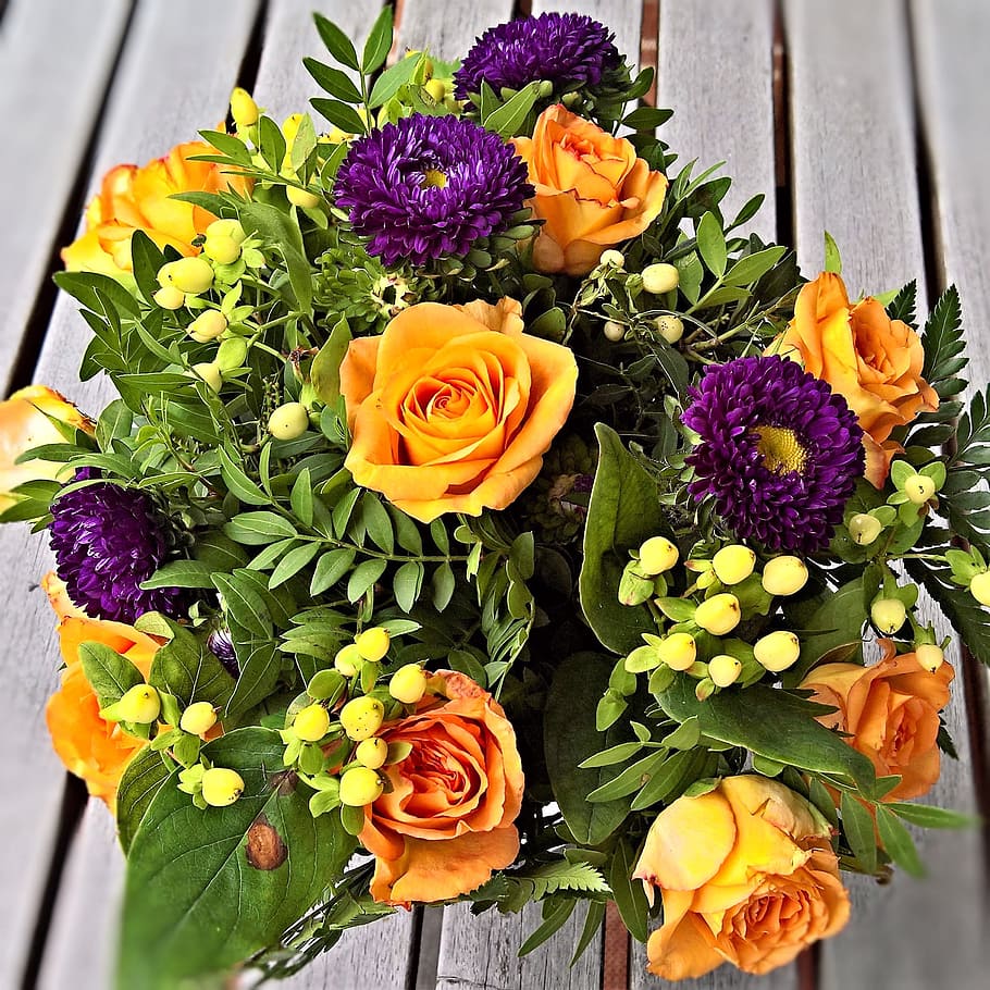 yellow, purple, and green flower center piece on brown wooden surface, HD wallpaper