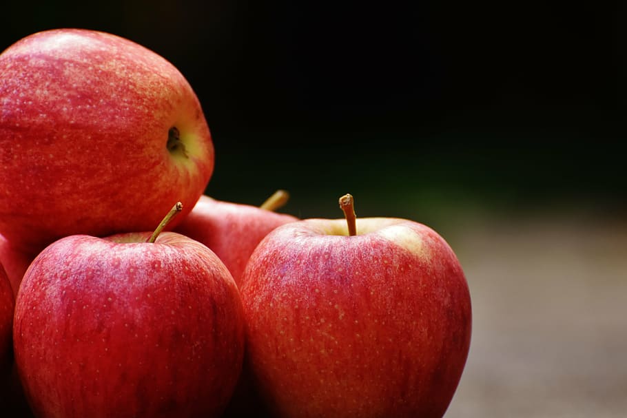 Premium Photo  Lots of tasty apples red organic envy apple new zealand top  view close up for wallpaper background