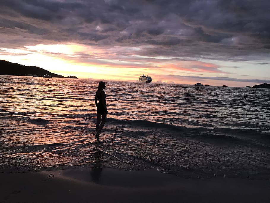 Woman in Body of Water, backlit, beach, clouds, dusk, evening HD wallpaper
