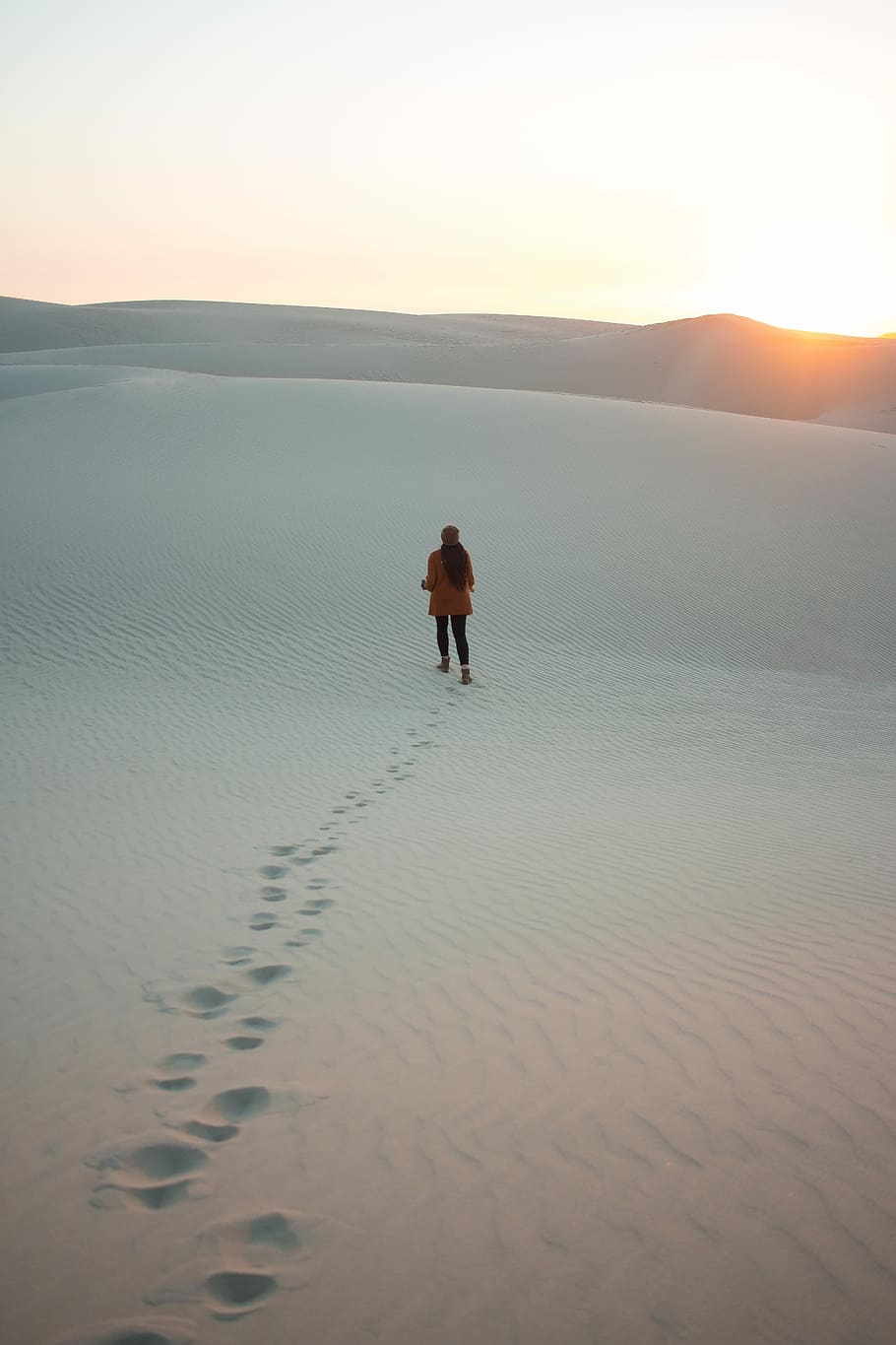 woman walking on dessert during daytime, person walking on sand during daytime HD wallpaper