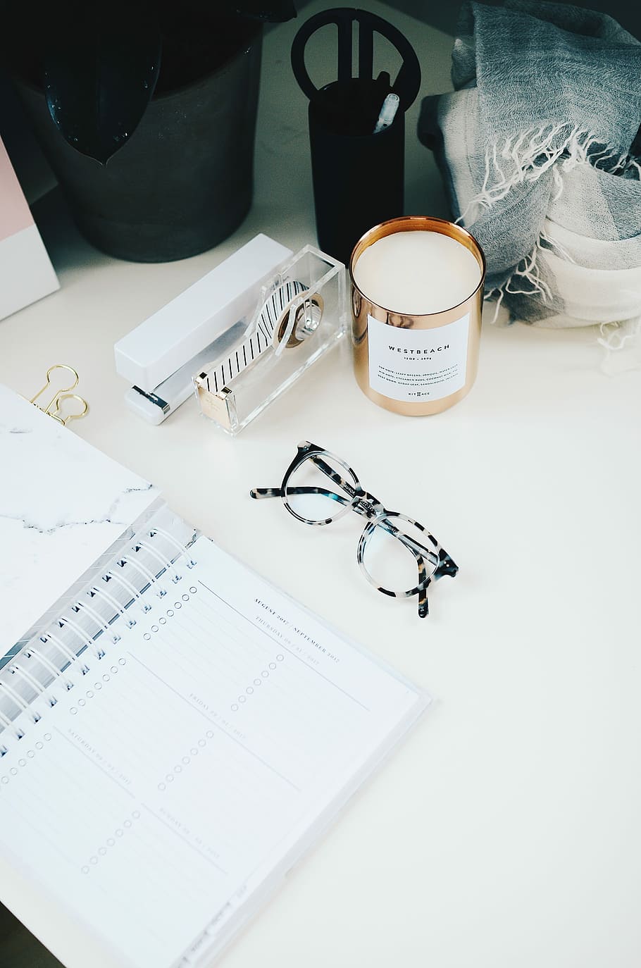 black framed eyeglasses beside spiral notebook, eyeglasses beside white ruled notebook HD wallpaper