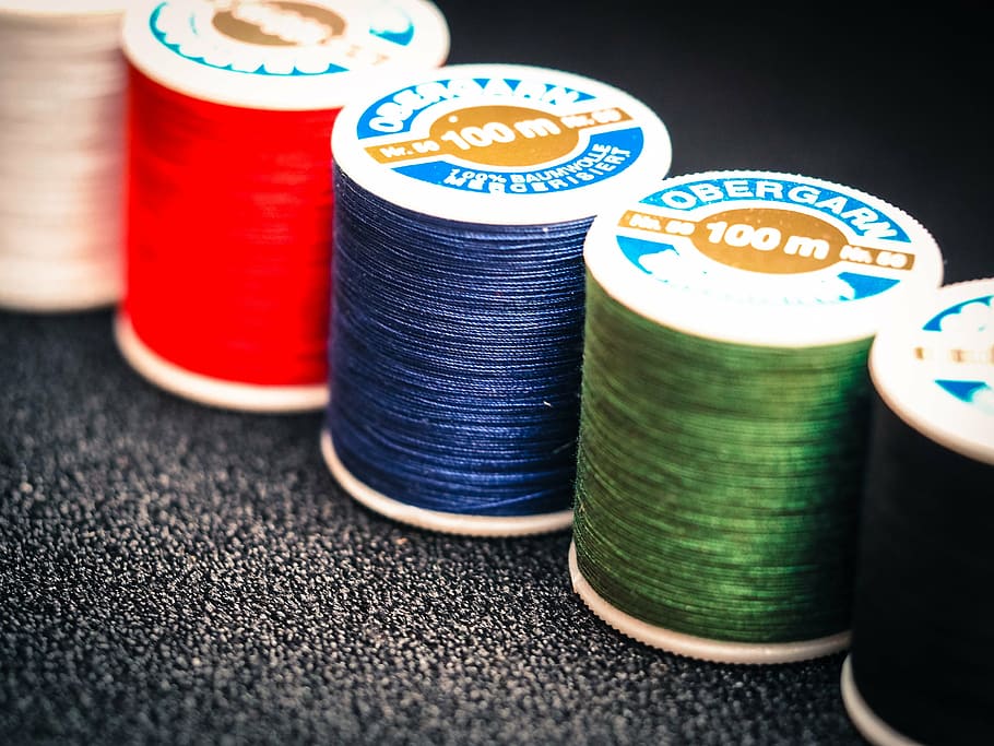 five 100 m assorted-color Obergarn sewing machine threads close-up photography HD wallpaper