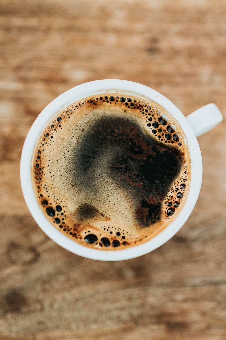 white ceramic mug filled with coffee, flat lay photography of brewed coffee filled teacup HD wallpaper