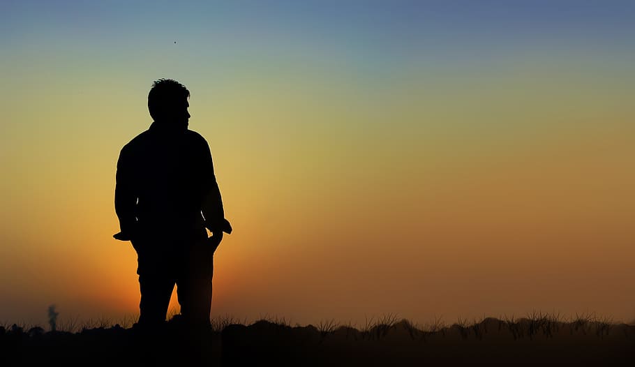silhouette man standing on field, shadow, alone, sunset, outdoors HD wallpaper