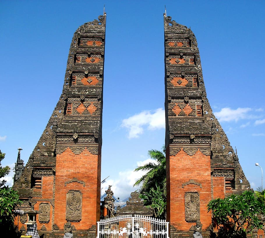 white steel gate between brown-and-gray concrete rocks, Bali, HD wallpaper