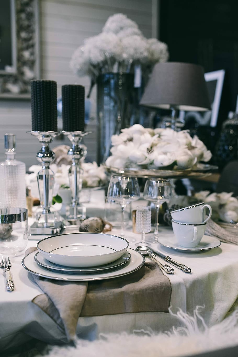Fancy restaurant dinner table decorated with quail eggs and feathers HD wallpaper