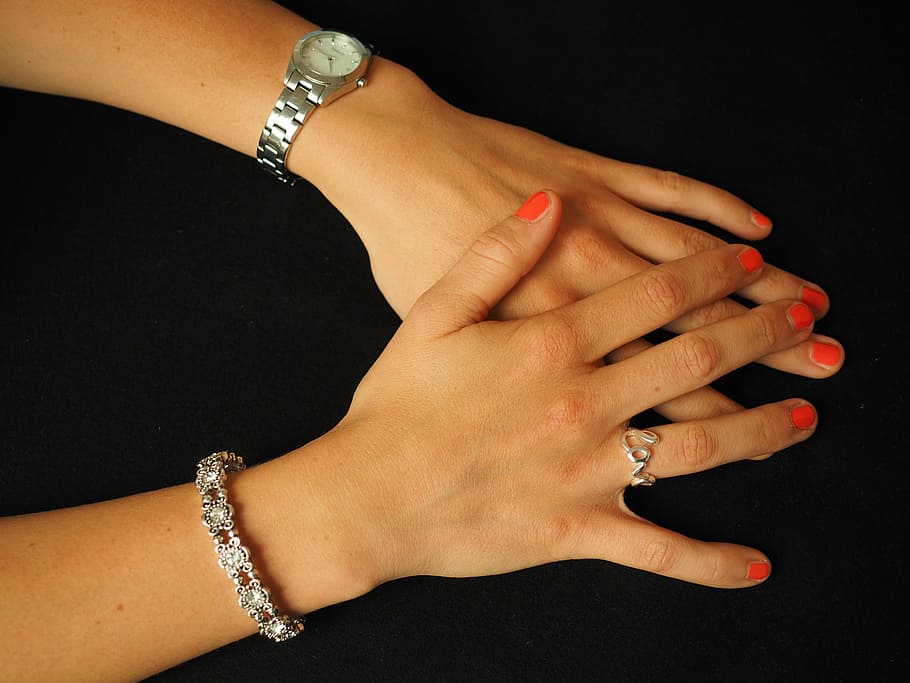 woman wearing round silver-colored analog watch, silver-colored link bracelet, and silver-colored cursive love ring HD wallpaper