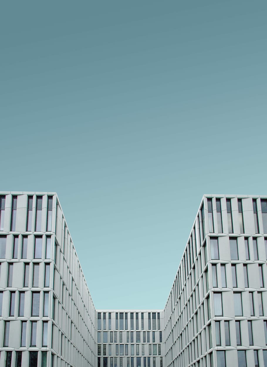man's eye view of white quadrangle building, low angle photo of grey buildings HD wallpaper