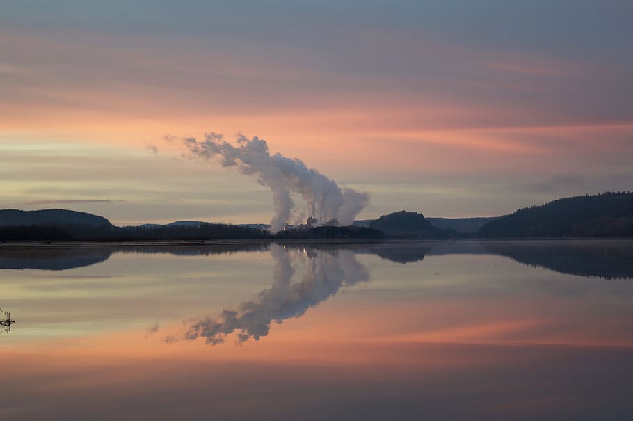 body of water under white clouds during orange sunset, body of water near mountain peak HD wallpaper