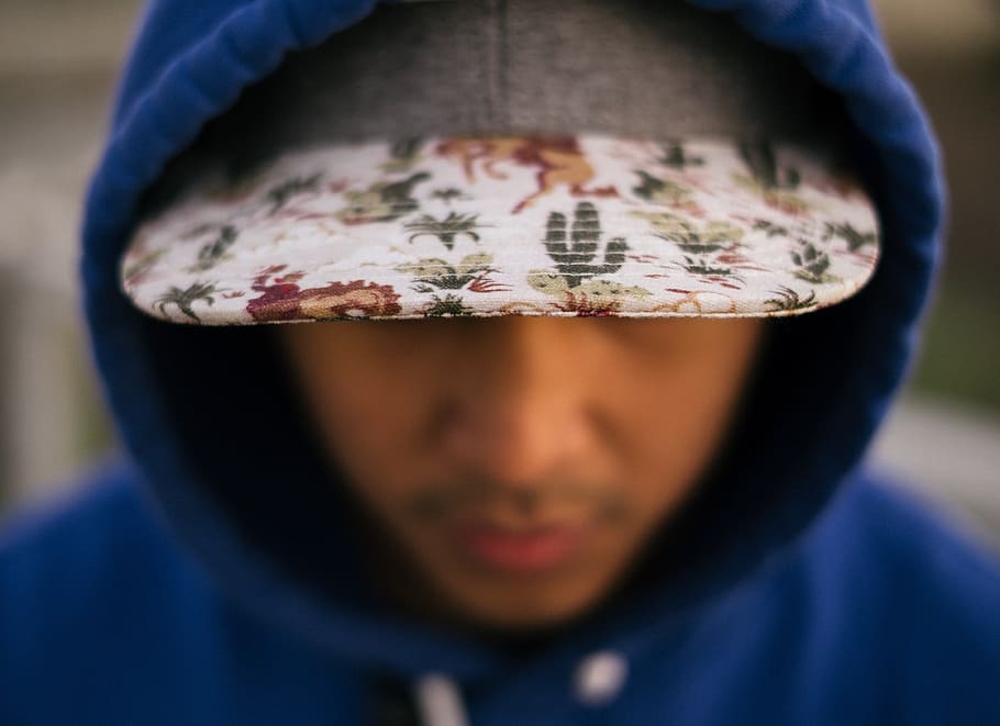 close up photo of white, green, and red floral cap, shallow focus photography of hooded man, HD wallpaper