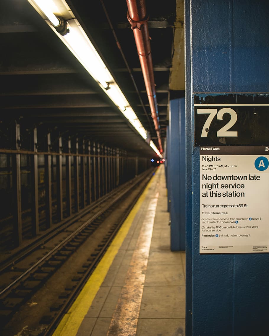 72 number printed board, white poster on blue wall near train railings HD wallpaper